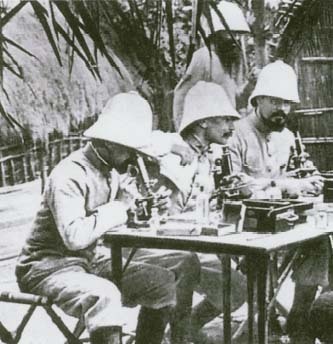 Restless in retirement, Robert Koch (seated center) traveled to Africa, where he made invaluable contributions to the study of trypanosomiasis, or sleeping sickness, a disease transmitted by the tsetse fly. To fight the disease, he recommended a program of deforestation to kill the tsetse fly by eliminating its habitat.