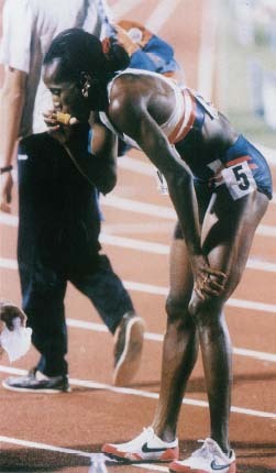 Jackie Joyner-Kersee uses an asthma inhaler after winning the 800-meter race (part of the women's heptathlon) at the World Athletics Championships in Stuttgart, Germany, July 17, 1993. Corbis/Reuters
