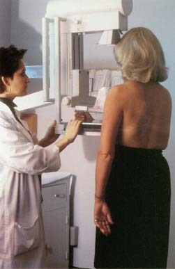 Screening (routine) mammograms contribute to earlier detection of cancer and improved treatment outcomes. © 1991 David Weinstein and Associates/Custom Medical Stock Photo.
