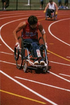 Wheelchair racers at International Games for the Disabled. Some of the racers have muscular dystrophy. © Gerhard Gscheidle, Peter Arnold, Inc.